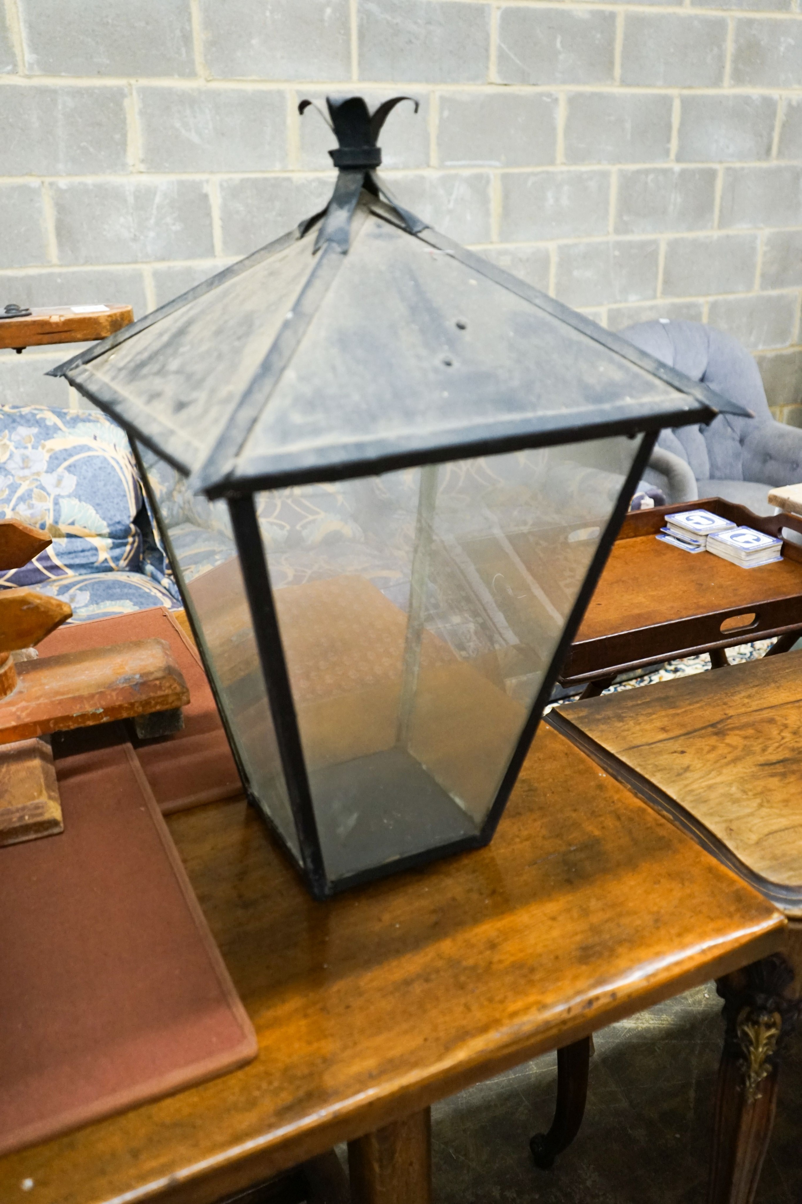 A pair of Victorian style black metal square lanterns, height 68cm together with one other and a reproduction convex wall mirror